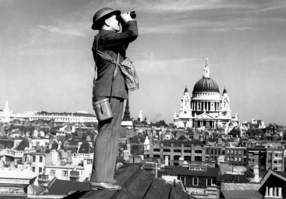 London Blitz - Soilder looking at sky through binoculars